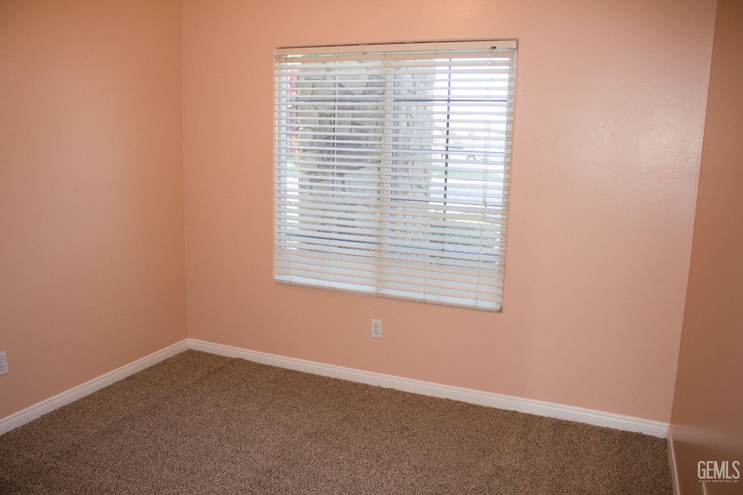 Undisclosed Address Bakersfield, CA 93312 - Photo 21 of 44 a view of an empty room with a window