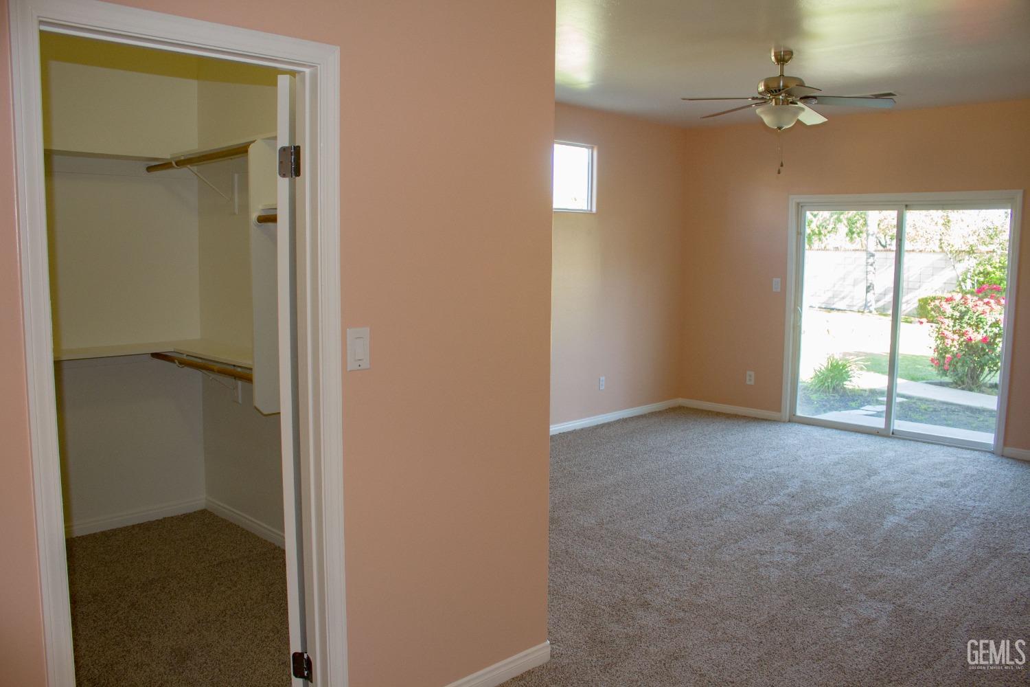 Undisclosed Address Bakersfield, CA 93312 - Photo 24 of 44 an empty room with windows and closet