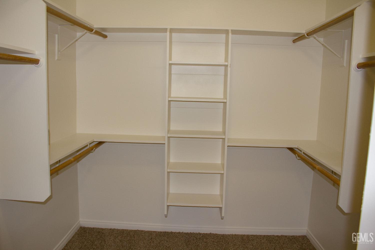 Undisclosed Address Bakersfield, CA 93312 - Photo 25 of 44 a view of an empty walk in closet