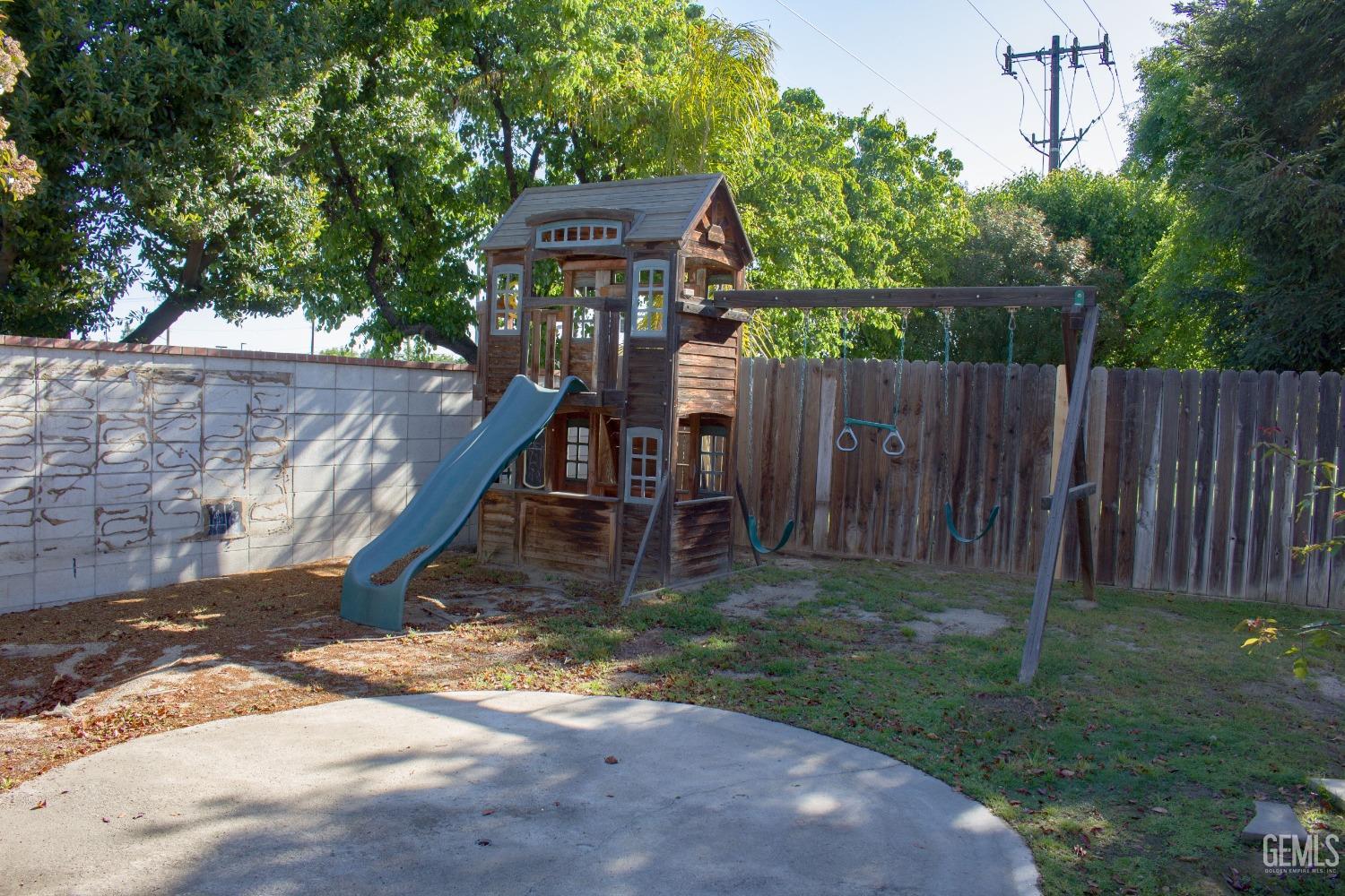 Undisclosed Address Bakersfield, CA 93312 - Photo 31 of 44 a view of a backyard with wooden fence