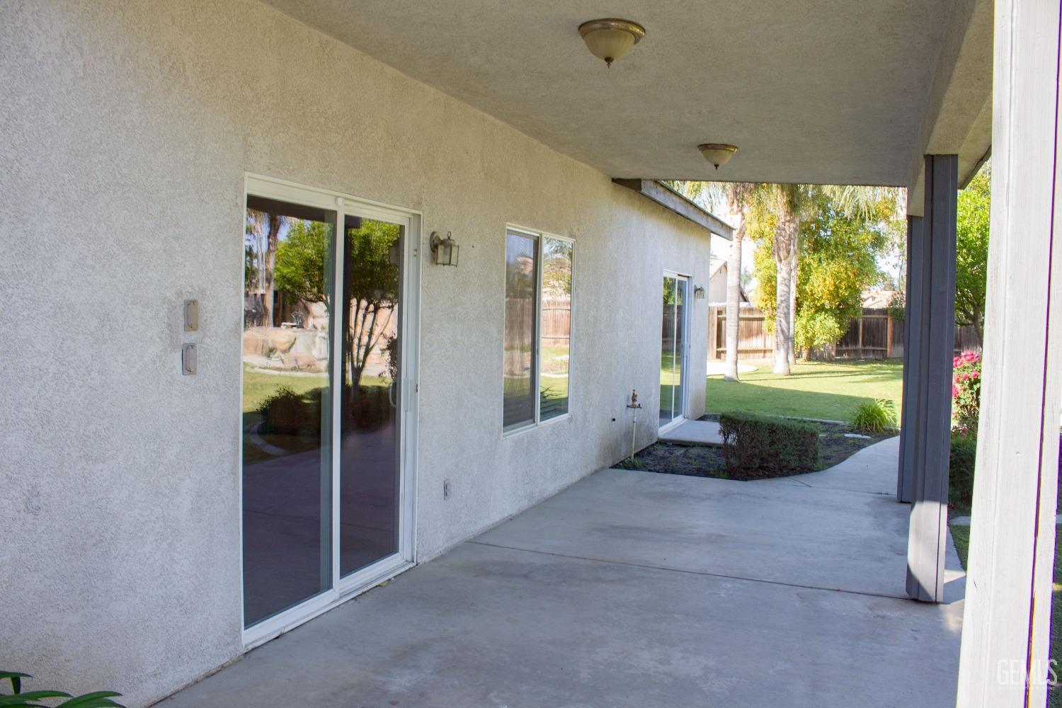 Undisclosed Address Bakersfield, CA 93312 - Photo 32 of 44 a view of a porch with furniture and floor to ceiling window