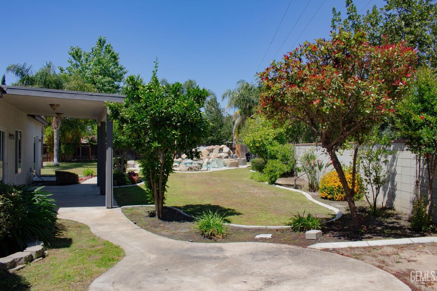 Undisclosed Address Bakersfield, CA 93312 - Photo 36 of 44 a view of a garden with potted plants