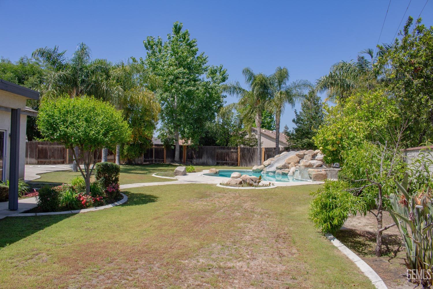 Undisclosed Address Bakersfield, CA 93312 - Photo 37 of 44 a view of a house with swimming pool and sitting area