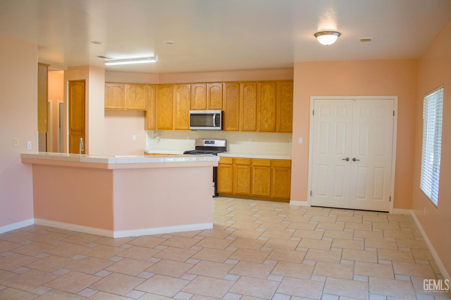 Undisclosed Address Bakersfield, CA 93312 - Photo 4 of 44 a view of kitchen with stainless steel appliances granite countertop a refrigerator sink and cabinets