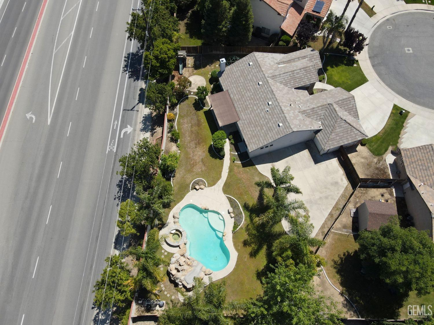 Undisclosed Address Bakersfield, CA 93312 - Photo 43 of 44 an aerial view of a house with garden space and outdoor seating