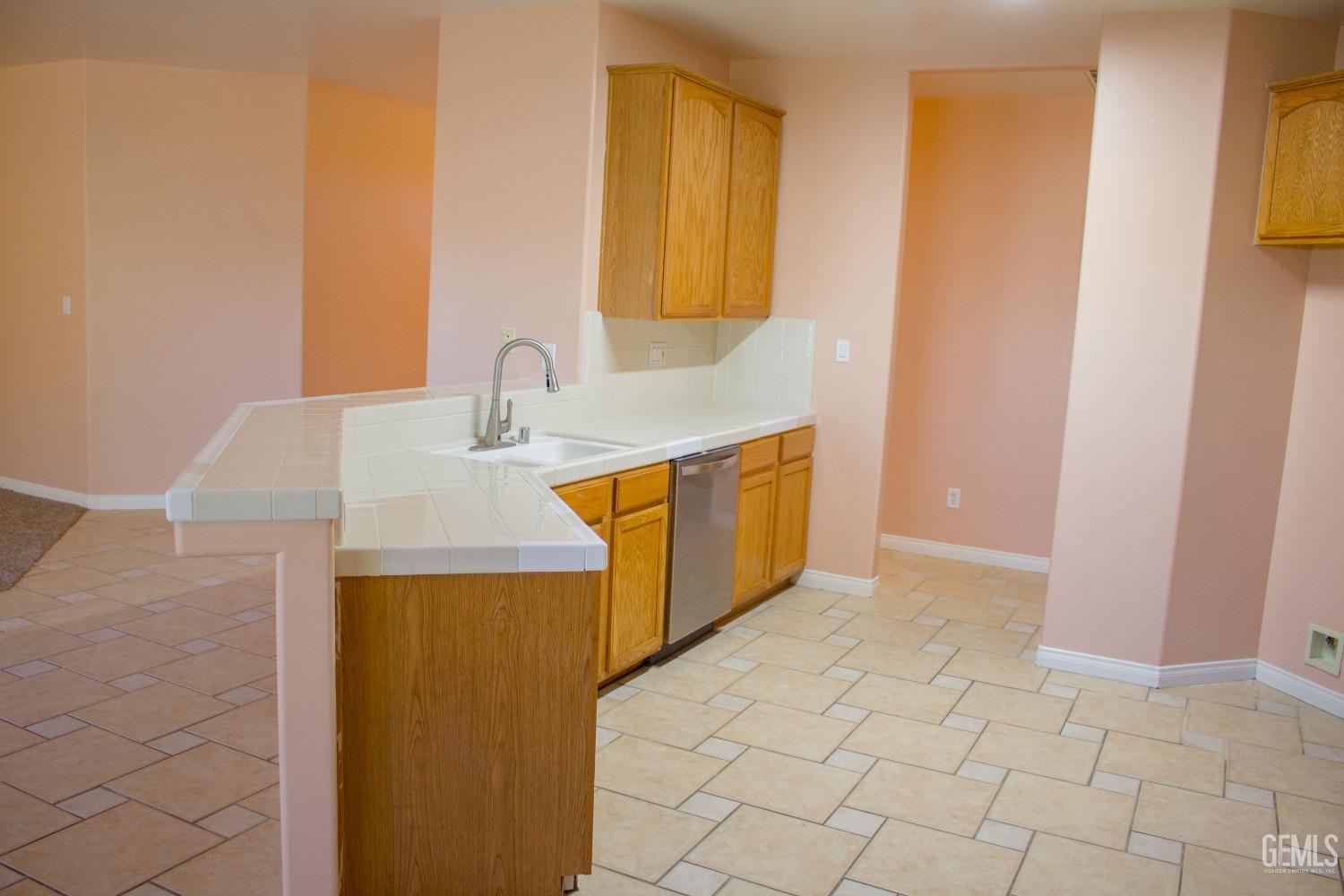 Undisclosed Address Bakersfield, CA 93312 - Photo 7 of 44 a bathroom with a sink a vanity and a mirror