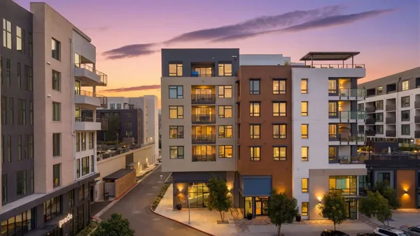 a front view of a building with glass windows