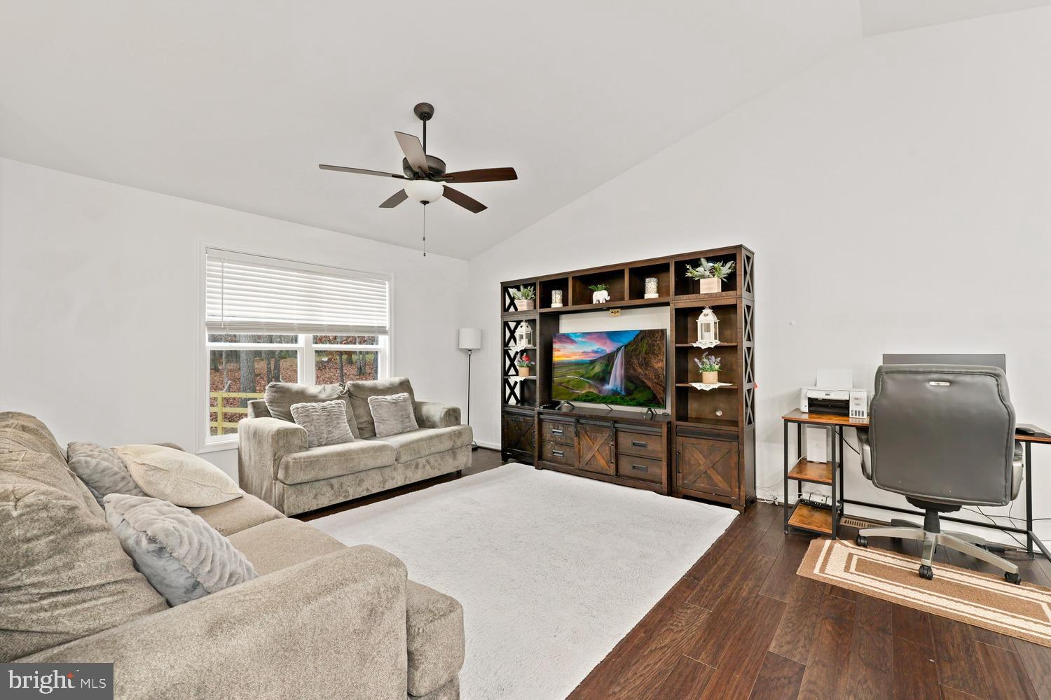 12749 Orange Plank Road Locust Grove, VA 22508 - Photo 5 of 38 Family room on upper level with vaulted ceiling