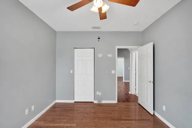 a view of gallery with wooden floor