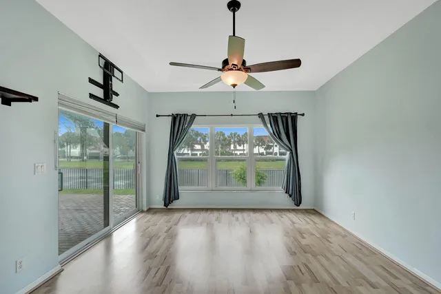 a kitchen with a cabinets and a refrigerator