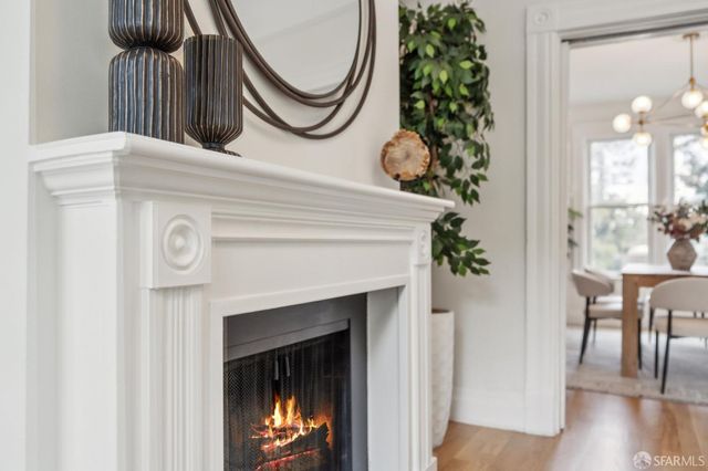 a view of a dining room with furniture and chandelier
