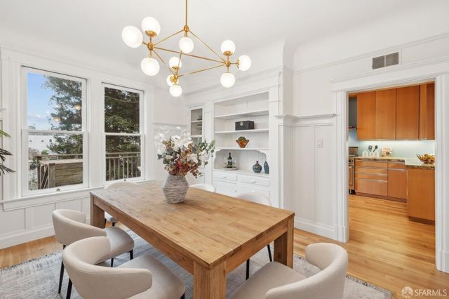a kitchen with stainless steel appliances granite countertop a refrigerator and a stove