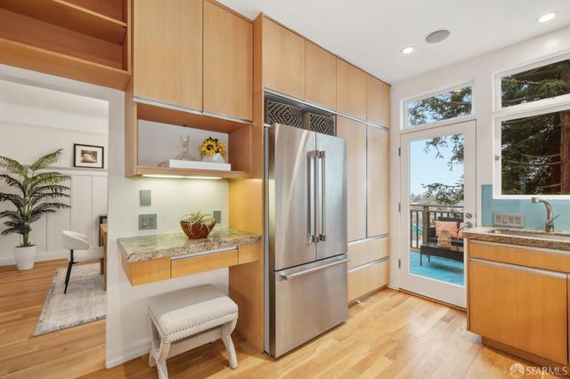 a view of a balcony with chair and wooden floor