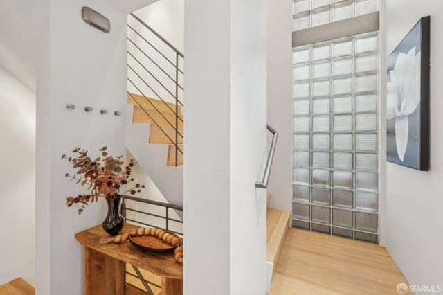 a bathroom with a granite countertop sink and a bathtub