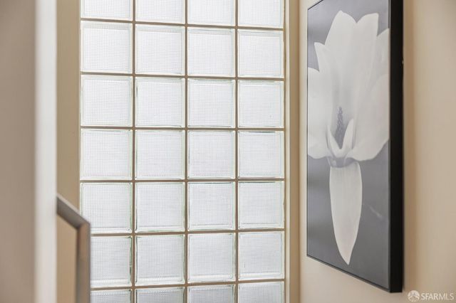 a bathroom with a shower and a glass door