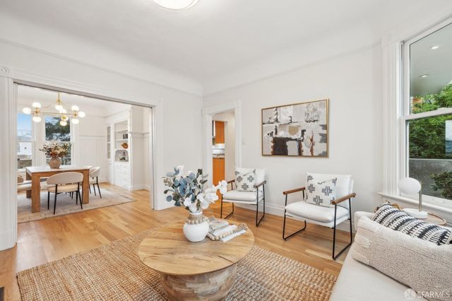 a view of a livingroom with furniture and a chandelier