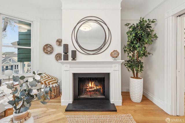 a view of a livingroom with furniture and a fireplace