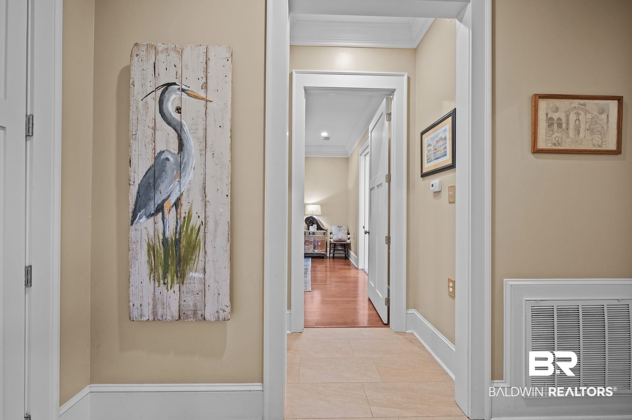 7850 Yorkhaven Road Mobile, AL 36695 - Photo 29 of 57 Hall with visible vents, baseboards, light tile patterned flooring, and crown molding