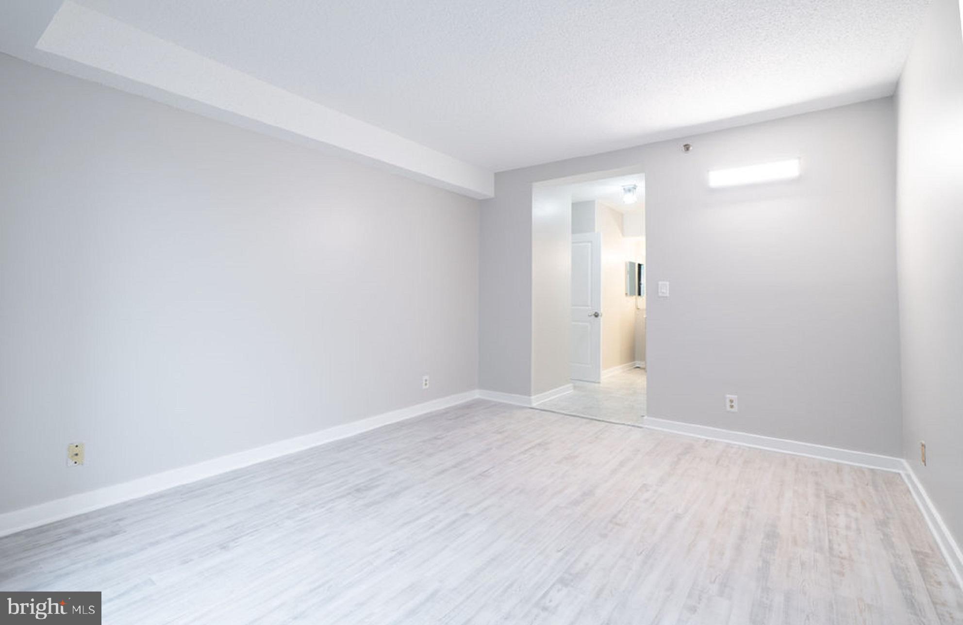 5505 Seminary Road, Unit 103N Falls Church, VA 22041 - Photo 21 of 59 a view of an empty room with wooden floor
