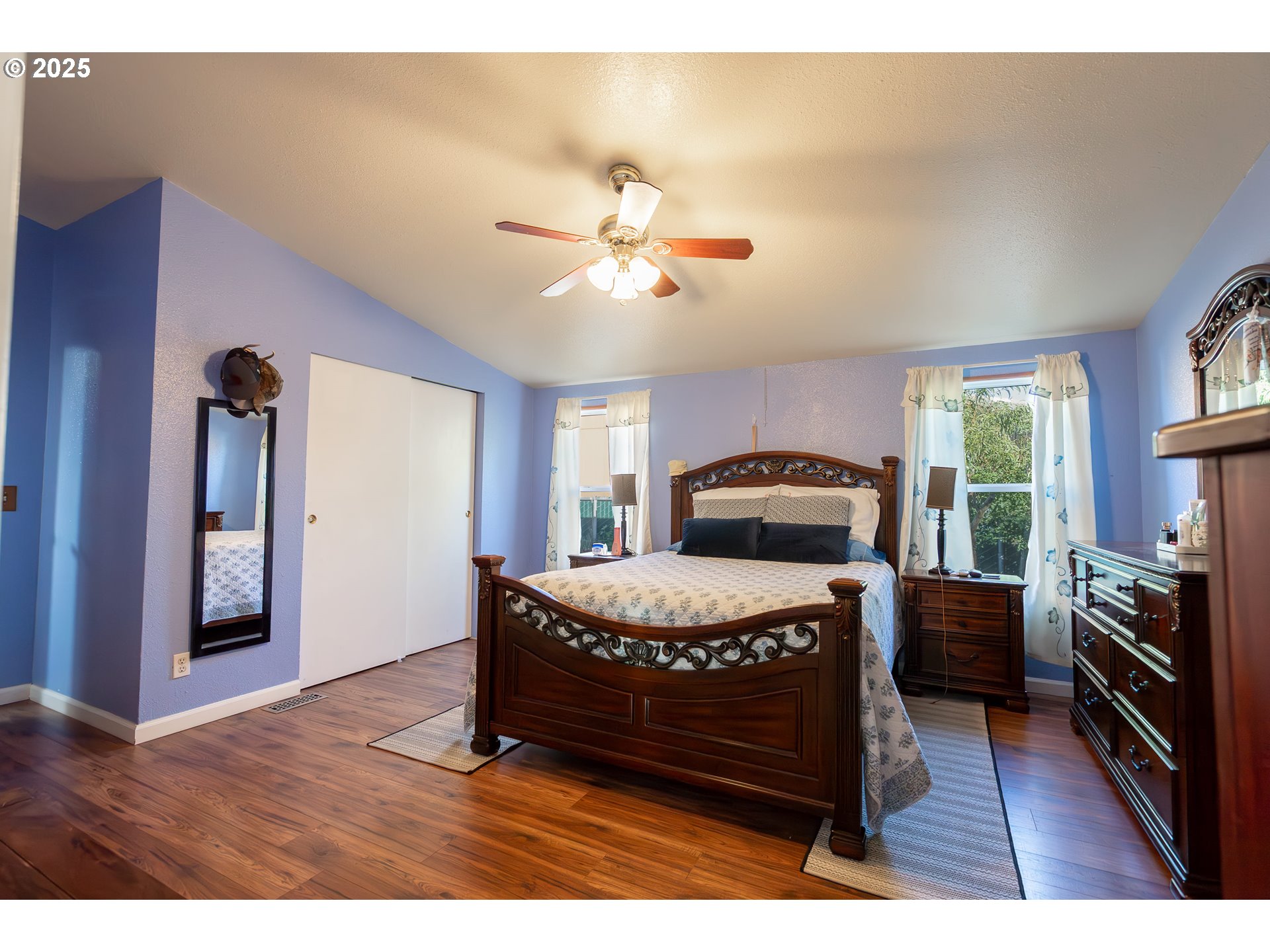 11105 Main Street Northeast, Unit 6 Donald, OR 97020 - Photo 11 of 23 a bedroom with a bed and a chandelier