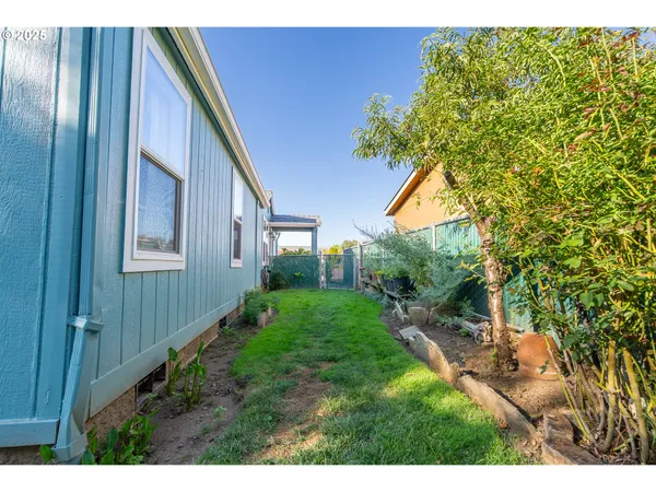 a backyard of a house with lots of green space
