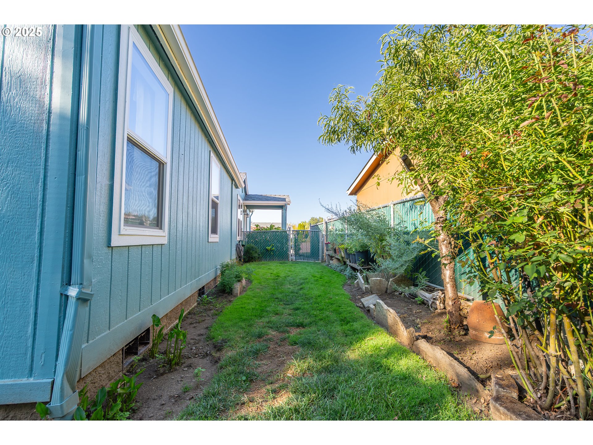 11105 Main Street Northeast, Unit 6 Donald, OR 97020 - Photo 22 of 23 a backyard of a house with lots of green space