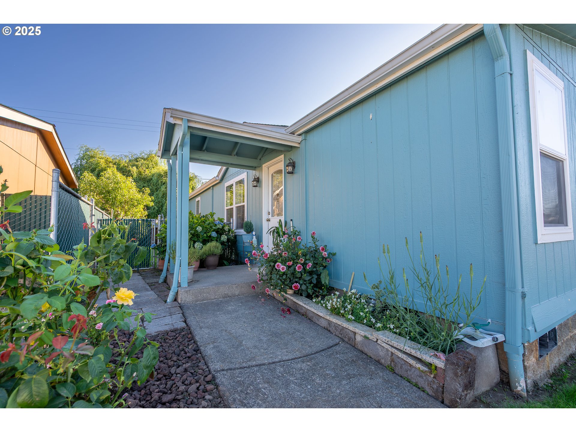 11105 Main Street Northeast, Unit 6 Donald, OR 97020 - Photo 3 of 23 a view of a backyard with potted plants