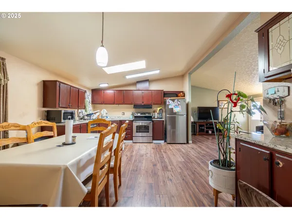 a kitchen view of counter top space a sink appliances and cabinets