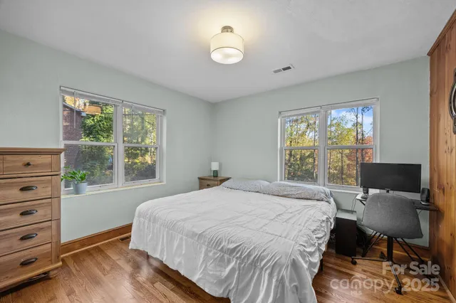 a bedroom with a bed and chair