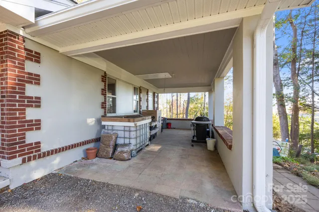 a view of hallway with wooden floor
