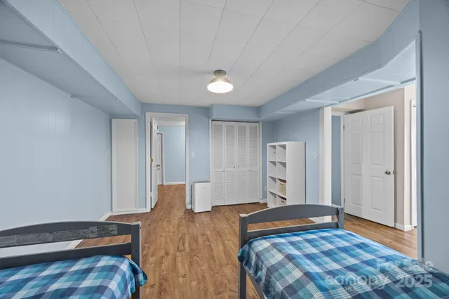 a living room with furniture and a piano