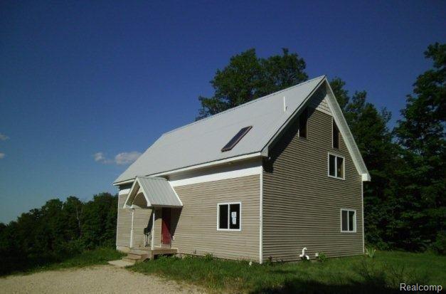 7629 Hency Road Kingsley, MI 49649 - Photo 1 of 7 71447940 Front view.jpg