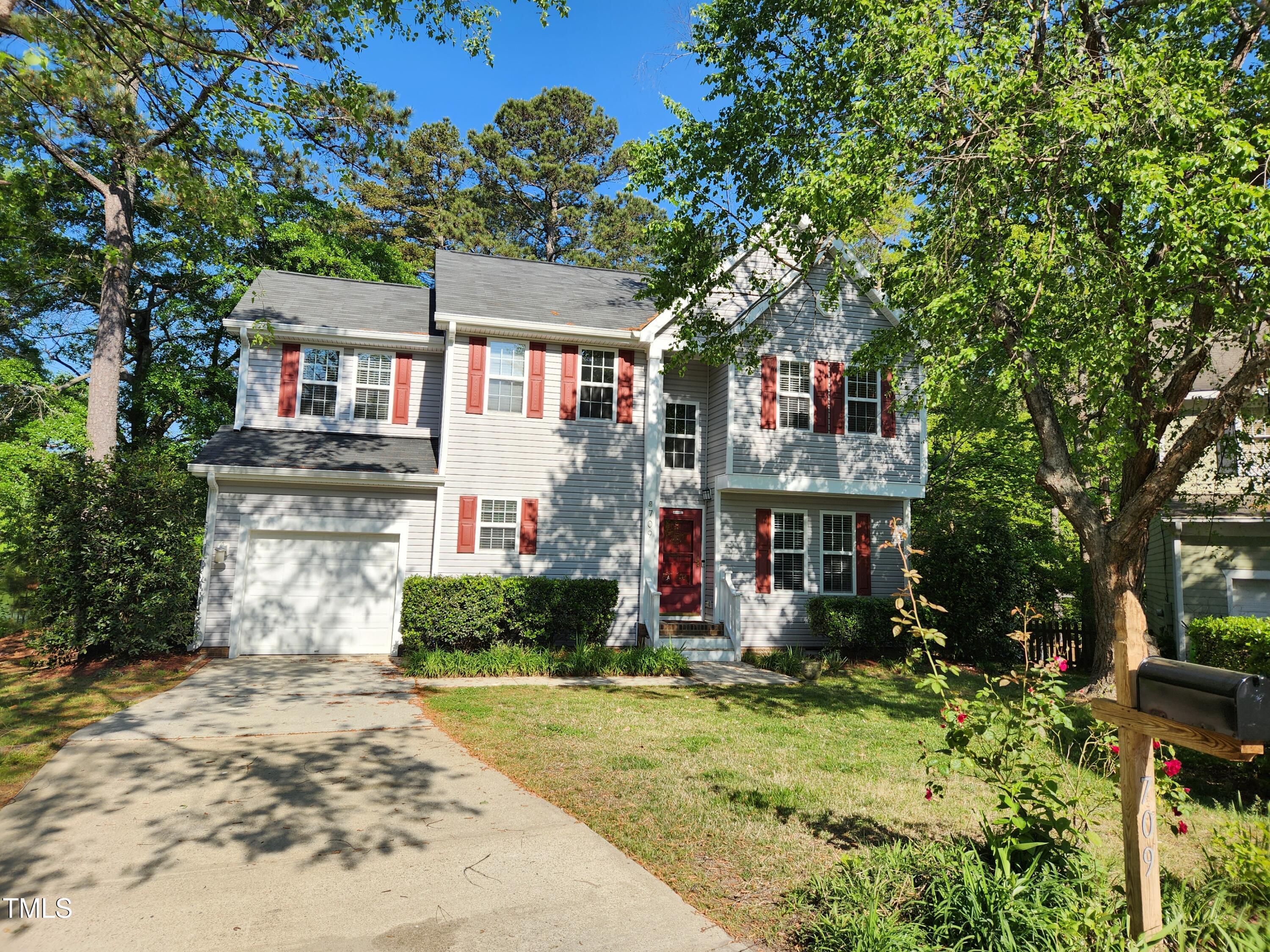 709 Thistlegate Trail Raleigh, NC 27610 - Photo 2 of 40 a front view of a house with a yard