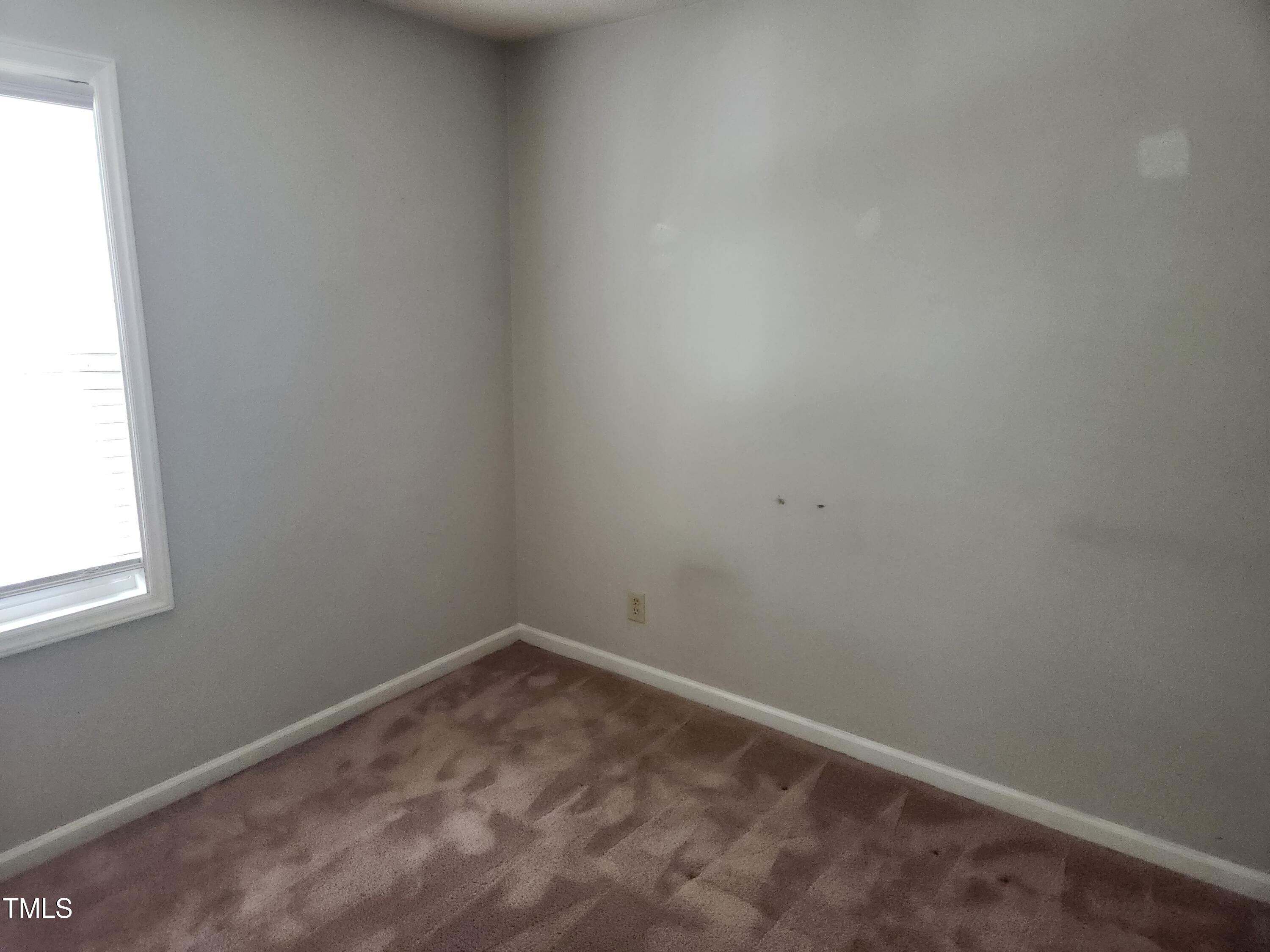 709 Thistlegate Trail Raleigh, NC 27610 - Photo 29 of 40 an empty room with a window