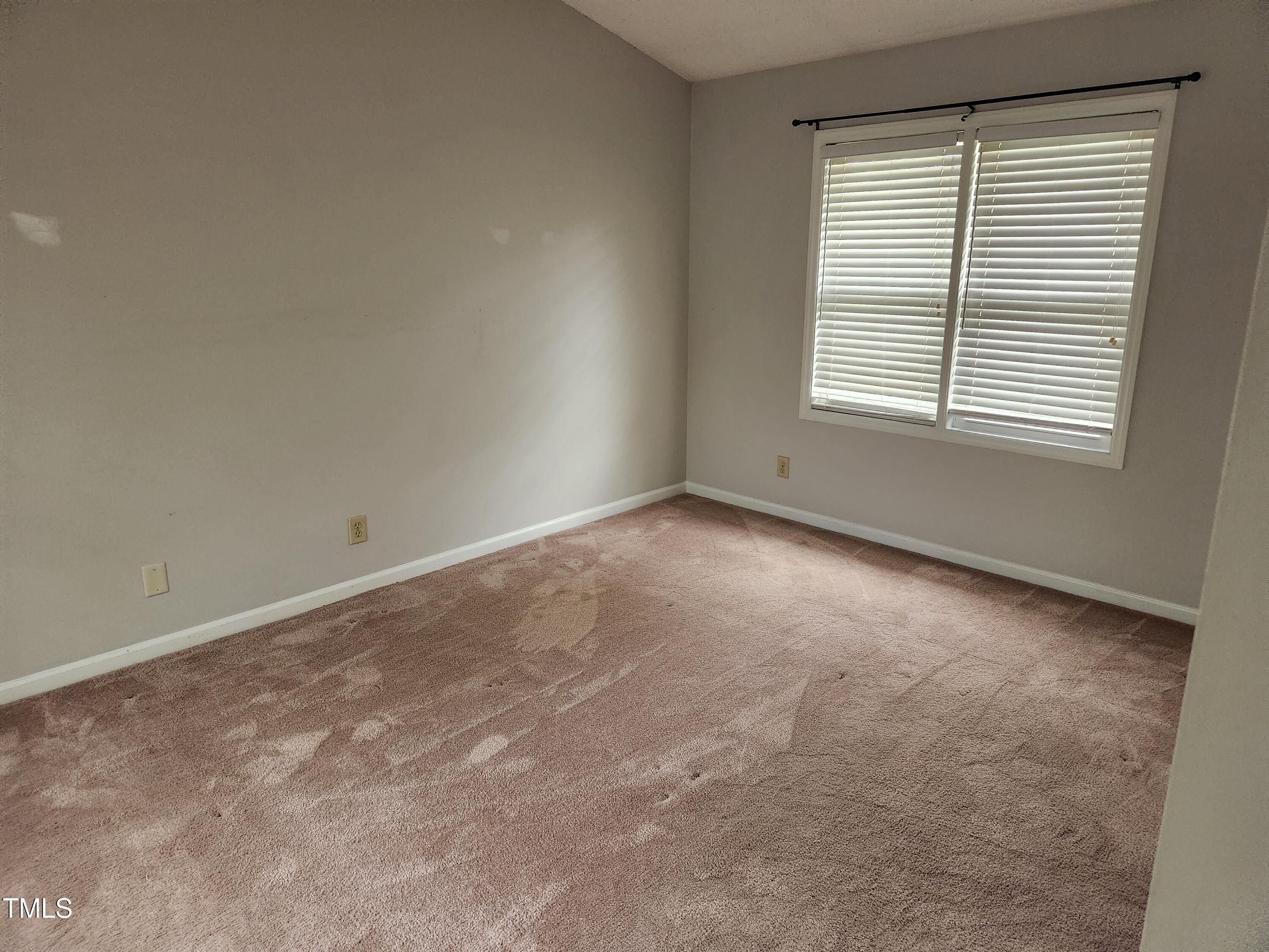 709 Thistlegate Trail Raleigh, NC 27610 - Photo 36 of 40 an empty room with a window
