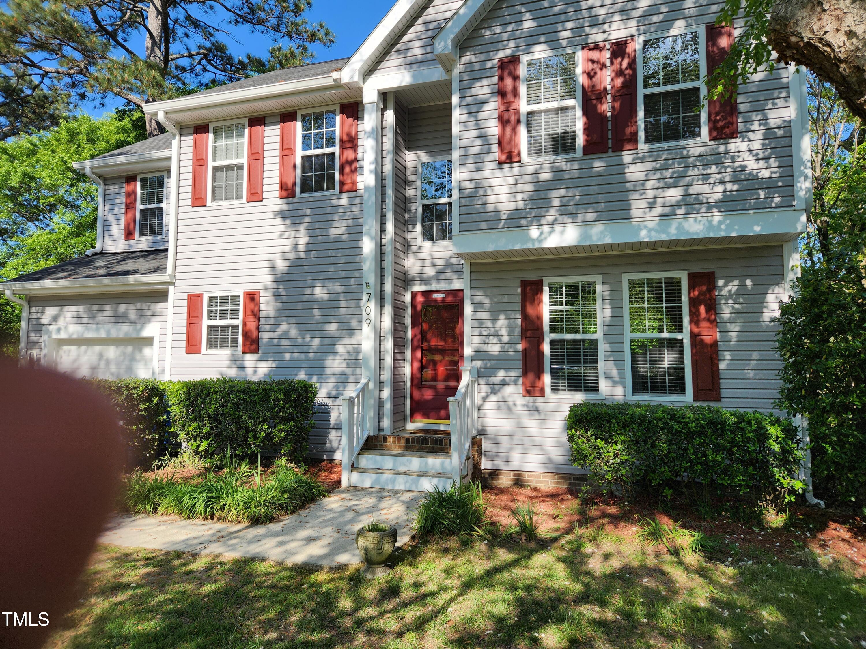 709 Thistlegate Trail Raleigh, NC 27610 - Photo 4 of 40 a front view of a house with garden