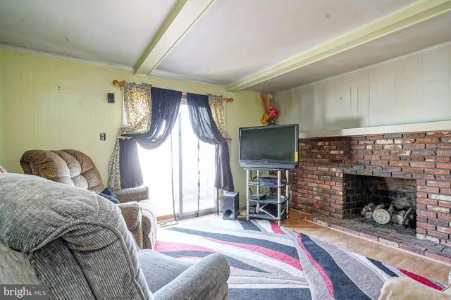 a bedroom with furniture and a fireplace