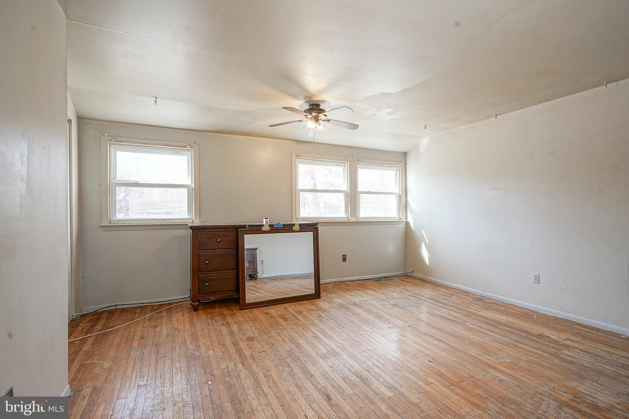 1638 Red Oak Road Williamstown, NJ 08094 - Photo 17 of 23 wooden floor in an empty room with a window