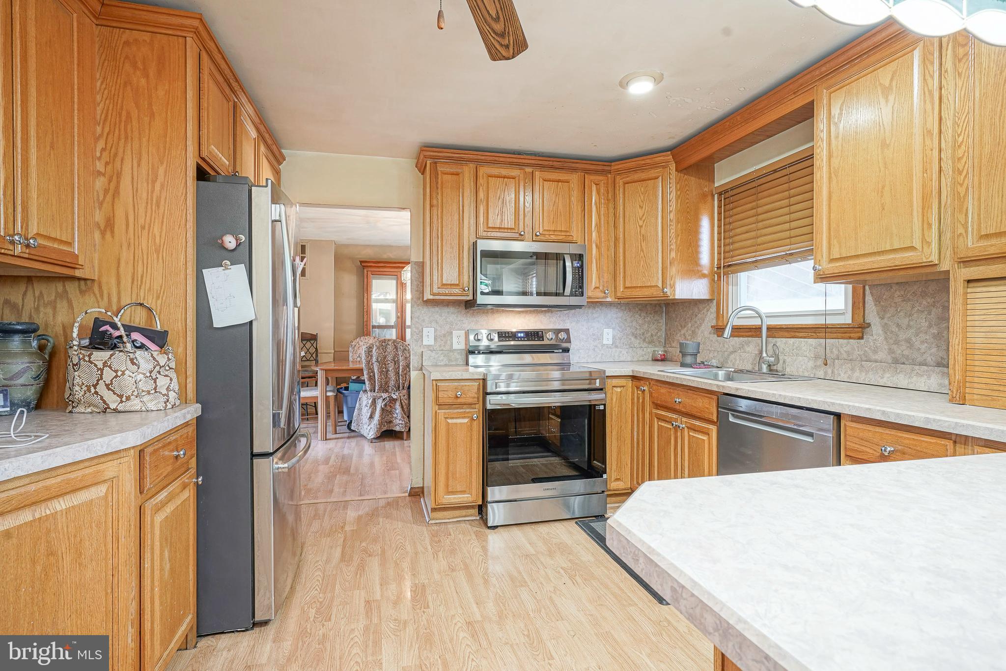 1638 Red Oak Road Williamstown, NJ 08094 - Photo 5 of 23 a kitchen with stainless steel appliances granite countertop a stove a sink dishwasher and a refrigerator