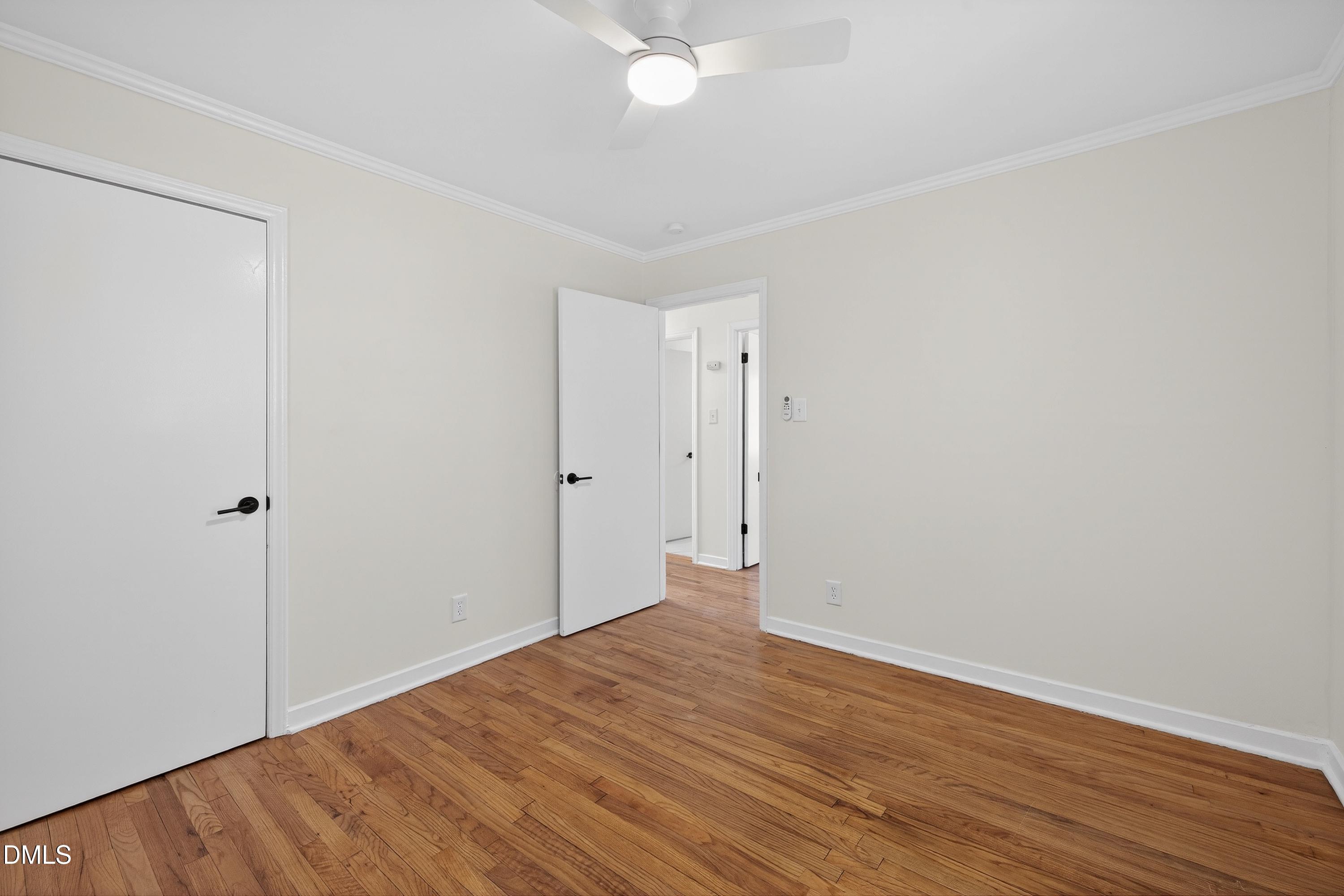 302 Normandy Street Durham, NC 27707 - Photo 23 of 29 a view of an empty room with wooden floor