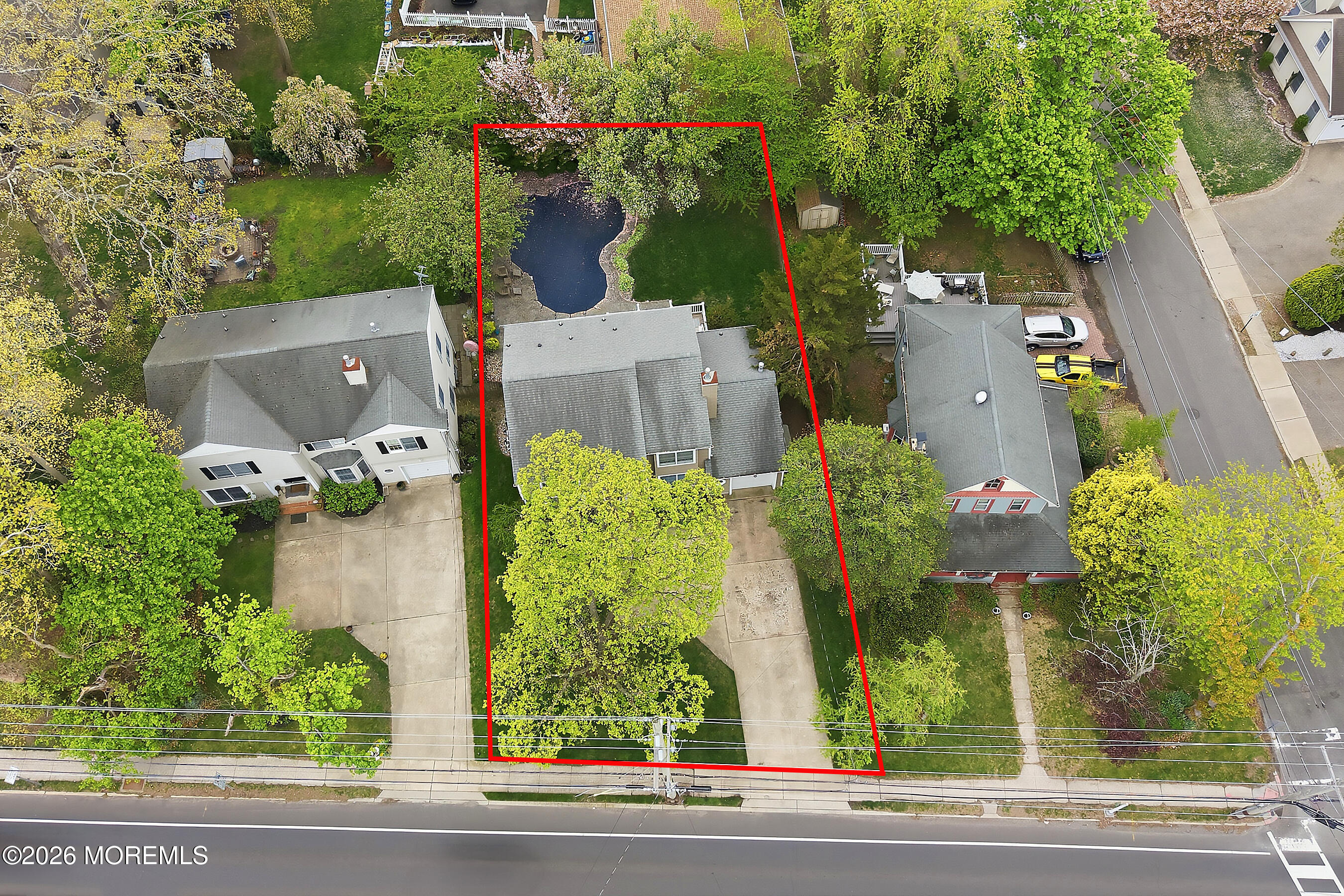 924 Ocean Road Point Pleasant, NJ 08742 - Photo 39 of 56 an aerial view of a house with a yard and large trees