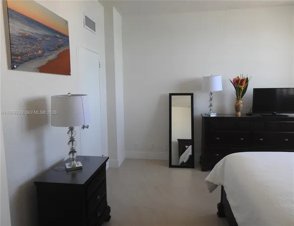 a view of a workspace with furniture and a flat screen tv