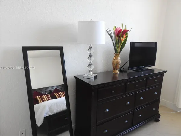 a bathroom with a sink vanity and a toilet