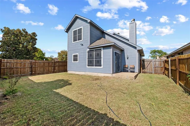 a house view with a backyard space