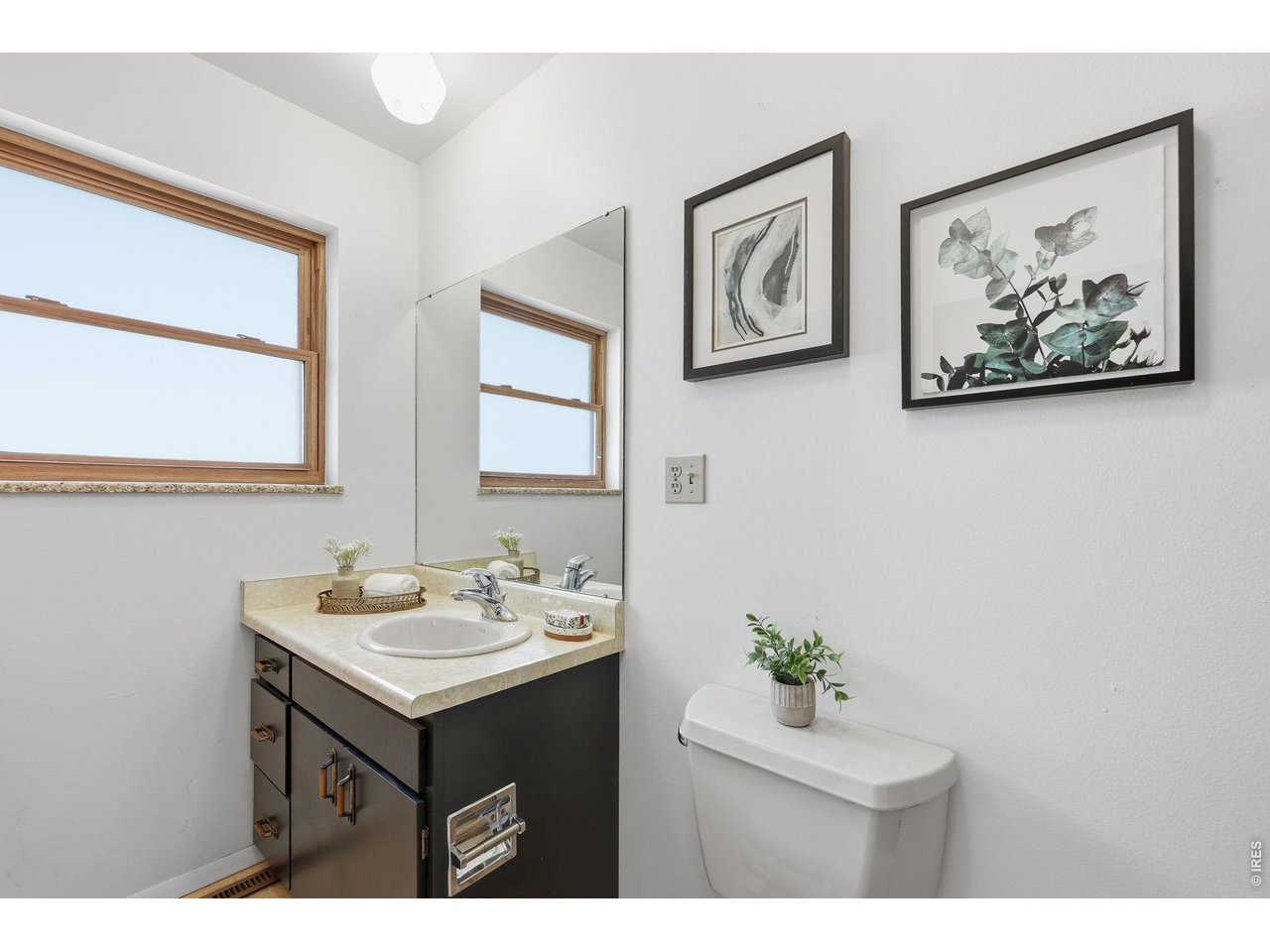 3355 16th Street Boulder, CO 80304 - Photo 10 of 23 a bathroom with a sink mirror and vanity