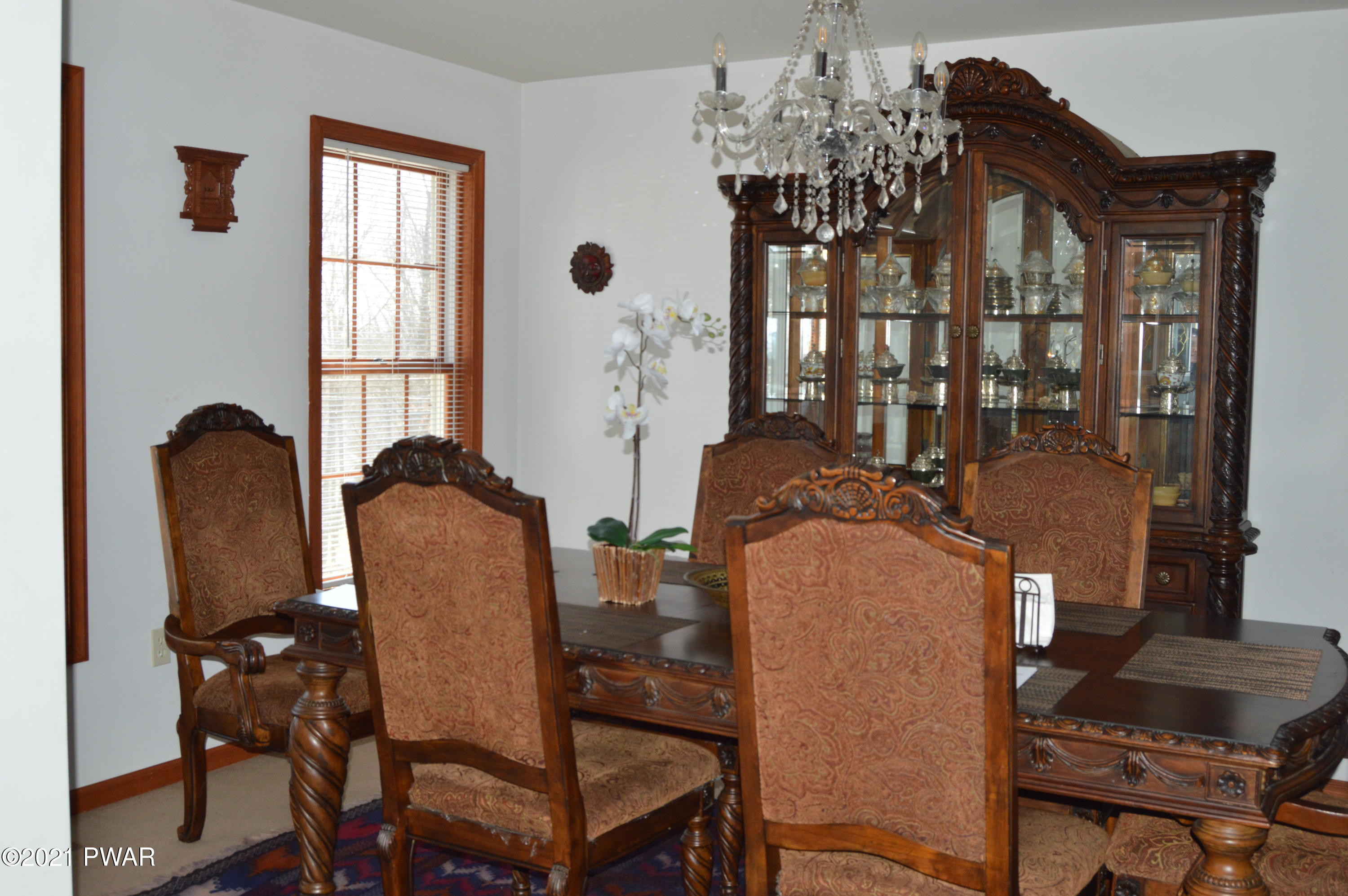4281 Pne Rdg Drive Bushkill, PA 18324 - Photo 9 of 30 a view of a dining room with furniture and chandelier