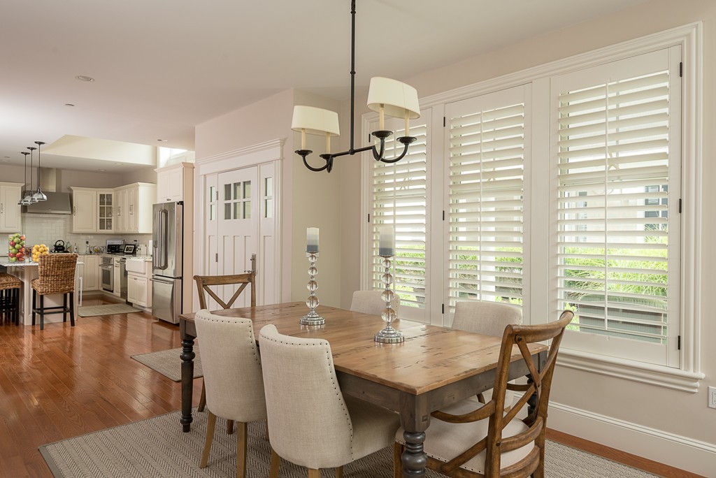 10 Backriver Road, Unit 10 Hingham, MA 02043 - Photo 15 of 30 a view of a dining room with furniture and wooden floor