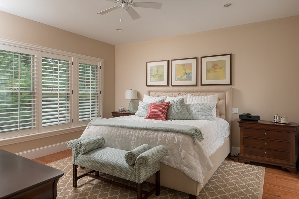 10 Backriver Road, Unit 10 Hingham, MA 02043 - Photo 16 of 30 a bedroom with a bed and wooden floor