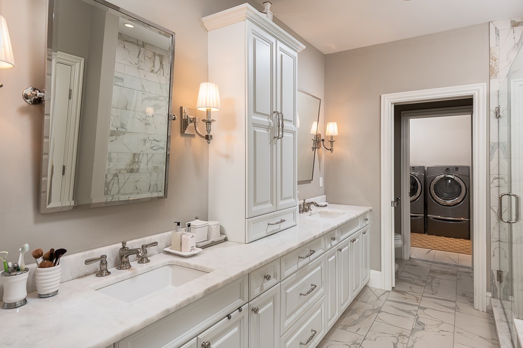 10 Backriver Road, Unit 10 Hingham, MA 02043 - Photo 18 of 30 a spacious bathroom with a granite countertop sink and a mirror