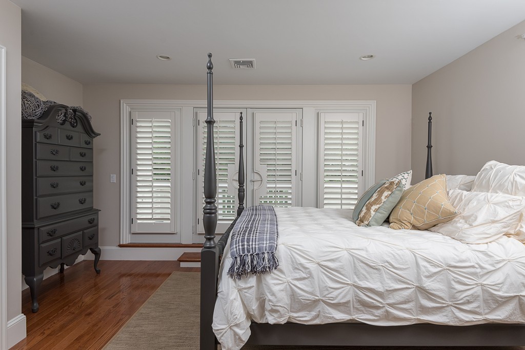 10 Backriver Road, Unit 10 Hingham, MA 02043 - Photo 20 of 30 a bedroom with a bed a window and walk in closet